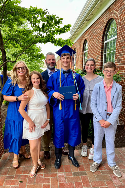 Allan with family at son's graduation